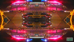 Very colorful photo with cars, lights and billboards reflecting each other.