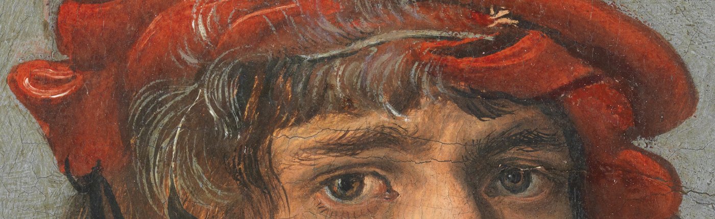 a part of a face including the eyes with a red hat in an old painting